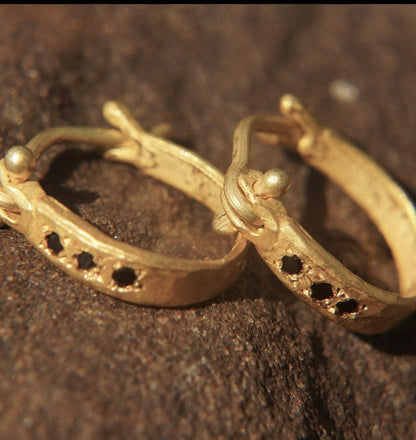 Custom 14k hammered huggie hoops, with Black Diamond Accents