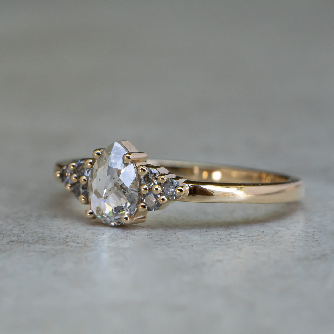 Icy White Pear Diamond Ring with Cluster Accents
