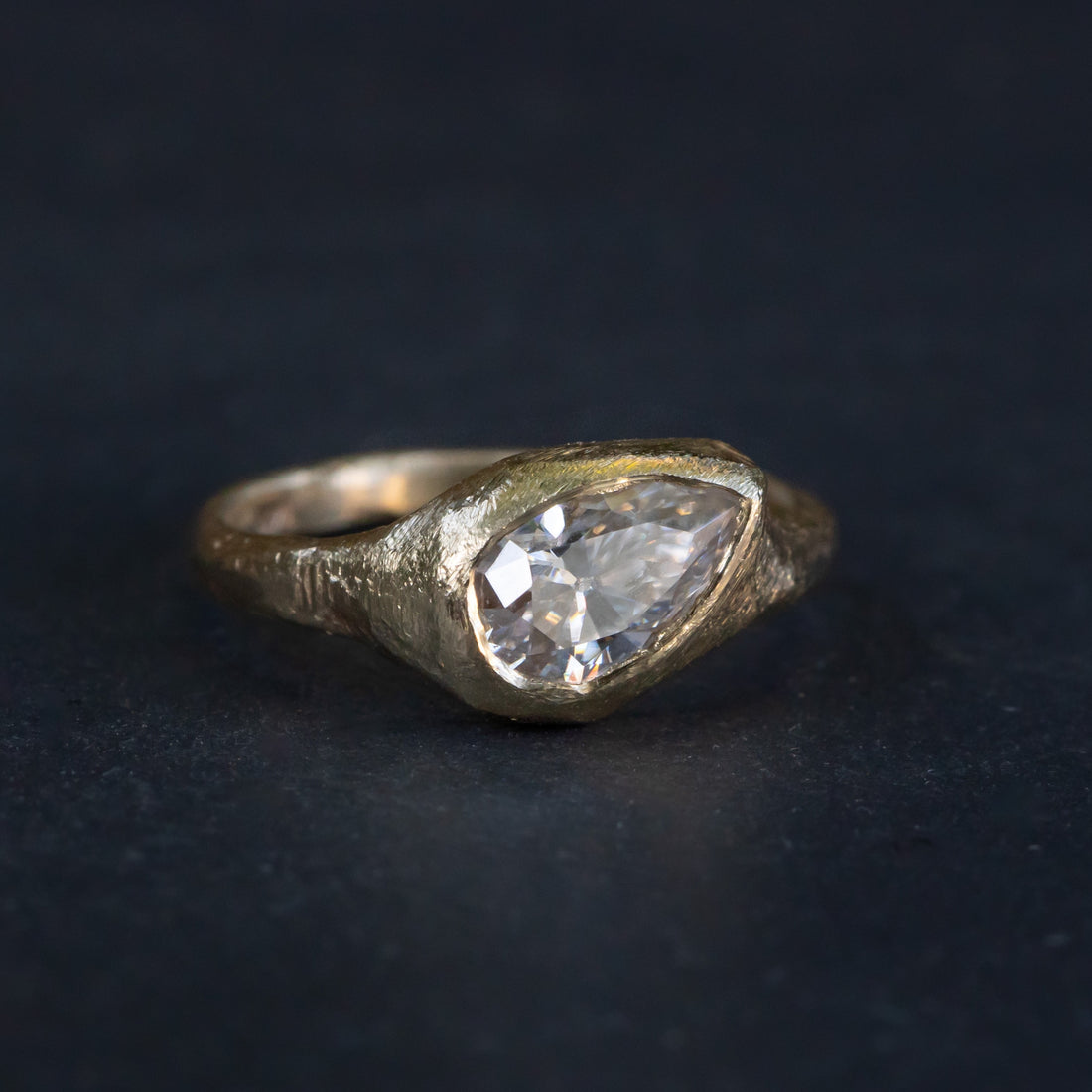 slanted pear diamond ring. horizoltal pear diamond ring. signet diamond ring